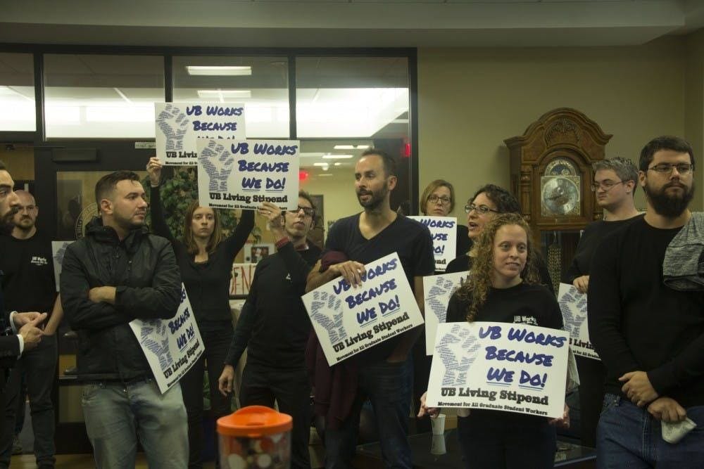 <p>After years of the Living Stipend Movement demanding a “living wage,” as seen here in 2018, UB announced on Monday that all "full-time funded" Ph.D. student stipends will raise to a baseline of $20,000 for the 2019-20 academic year.</p>