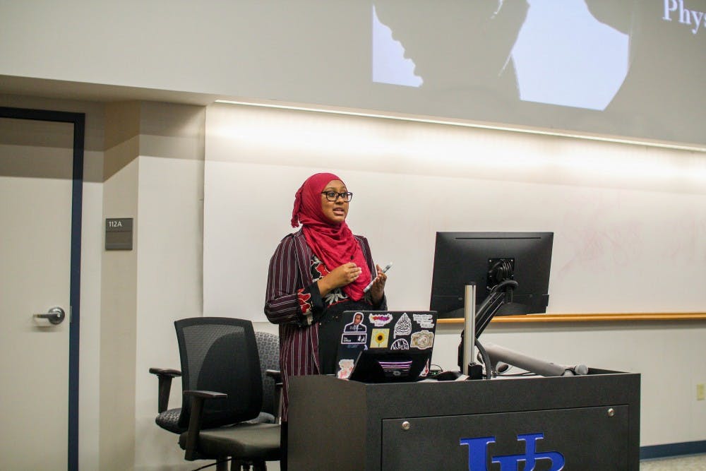 <p>Muslim Student Association member Ilhan Noor introduces guest speaker April Arman.</p>