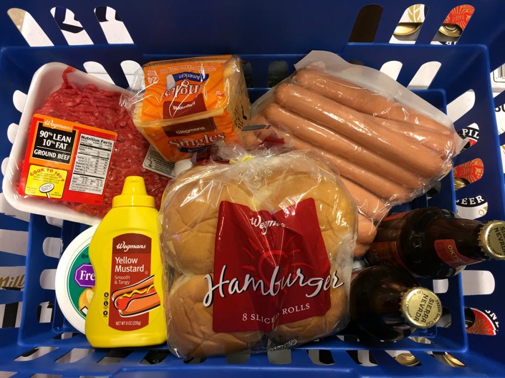 <p>Some of the essentials of tailgating are all here in this cart, headlined by hot dogs, ground beef for hamburgers and beer.</p>