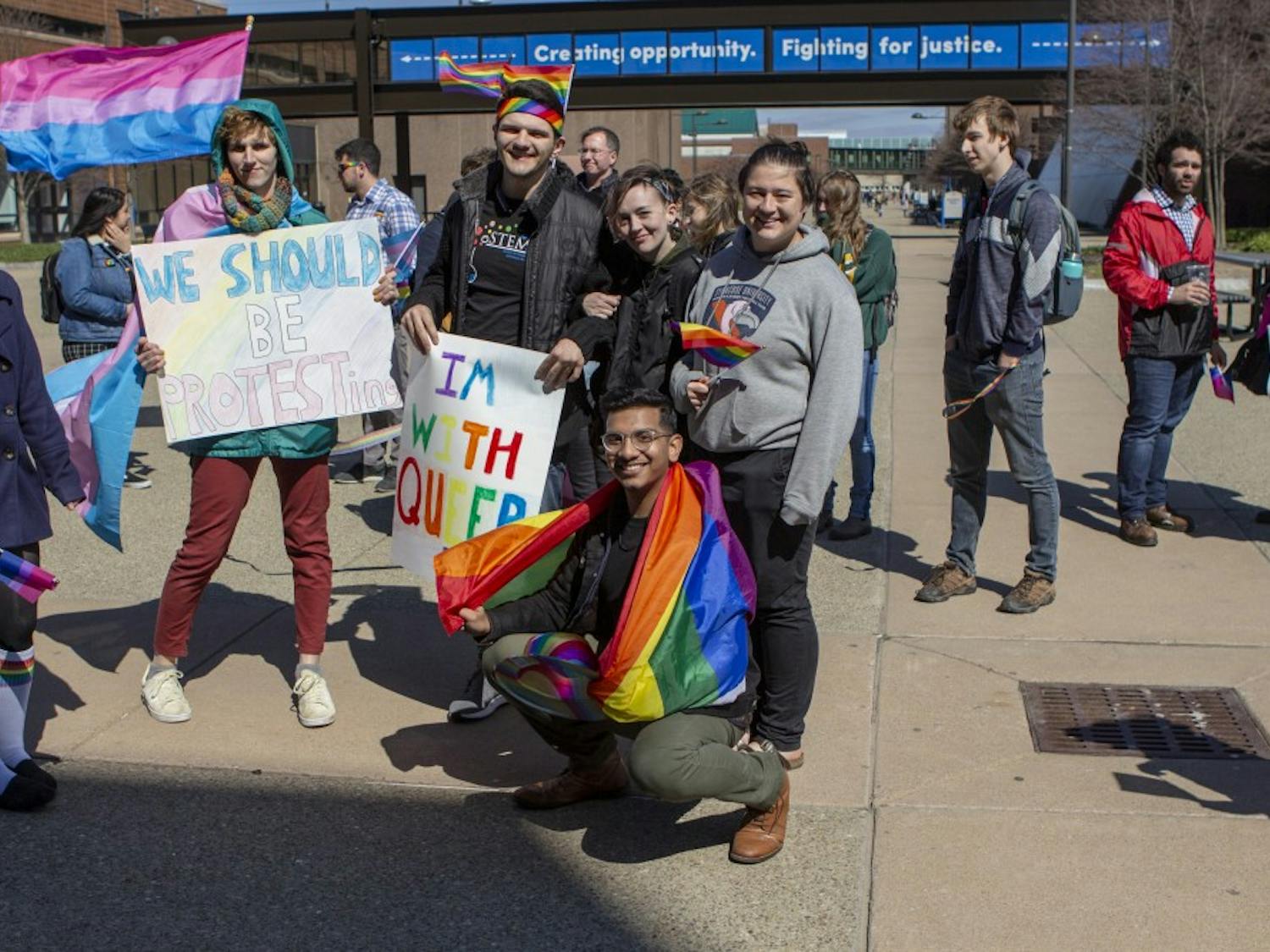 UB students march on the Academic Spine of North Campus for UB’s LGBTQ Pride Parade on Wednesday. Students ended the march at the Student Union, where began a pride festival.
