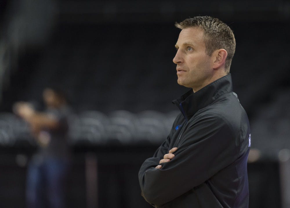 <p>Head coach Nate Oats looks on during the&nbsp;Bulls' open practice Wednesday before their NCAA Tournament against Miami.&nbsp;</p>