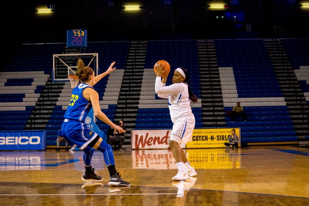 <p>Junior guard Cierra Dillard looks for the shot from behind the arc. Dillard had several great performances in the NCAA Tournament this year when the Bulls made it to the Sweet Sixteen.</p>
