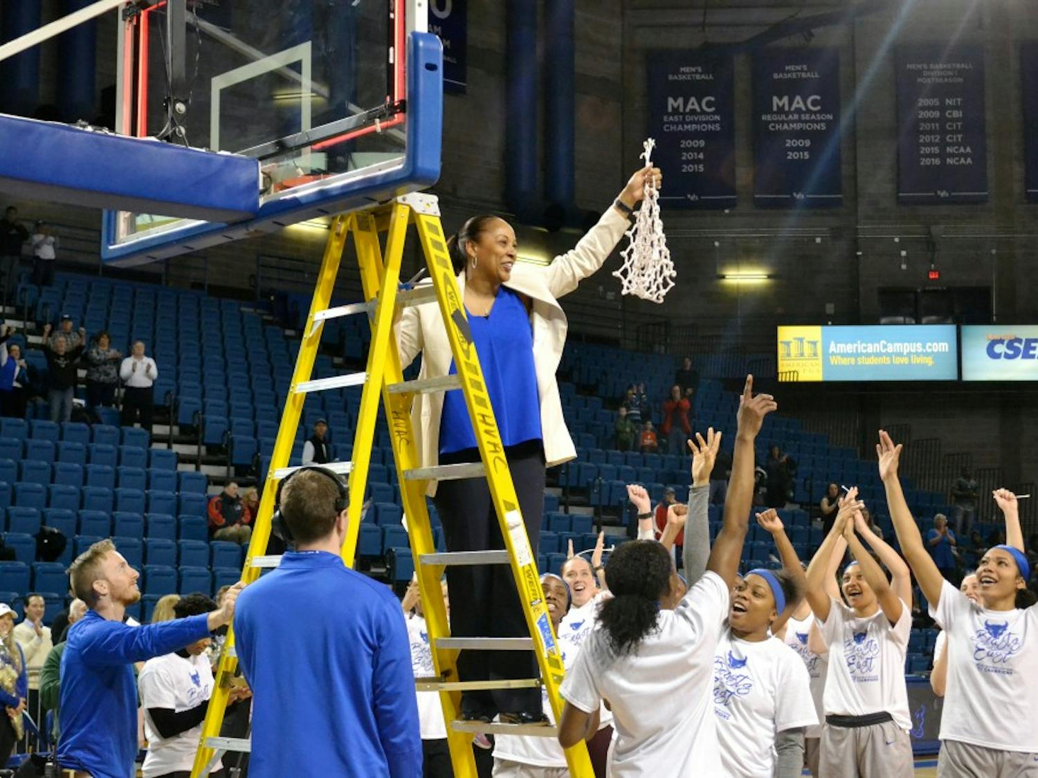 Head coach Felisha Legette-Jack cuts down the nets after the Bulls secured the No. 1 seed in the MAC Tournament back in March. Legette-Jack's new contract comes after a historic season for the program.