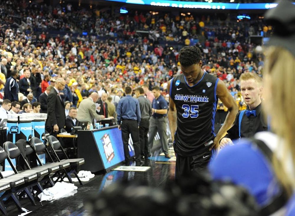 <p>Senior forward Xavier Ford walks off the court after Buffalo's 68-62 loss to West Virginia in the second round of the NCAA Tournament Friday. Ford hit a 3-point basket to tie the game at 62, but Buffalo ultimately fell 68-62 to end its season. </p>