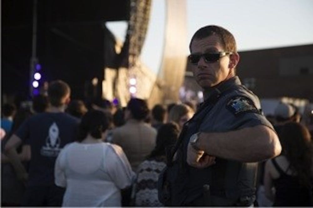 <p>UPD’s Lieutenant Scott Bixby patrols and helps with crowd control at Spring Fest last May. UPD recently received accreditation from IACLEA and has achieved a “gold standard.”</p>