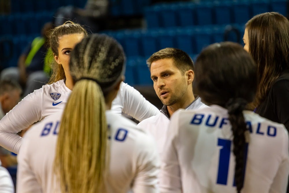 <p>New volleyball head coach Scott Smith talks with the Bulls during a game this past season. Smith wants to continue building the program after spending the last four as an assistant coach.</p>