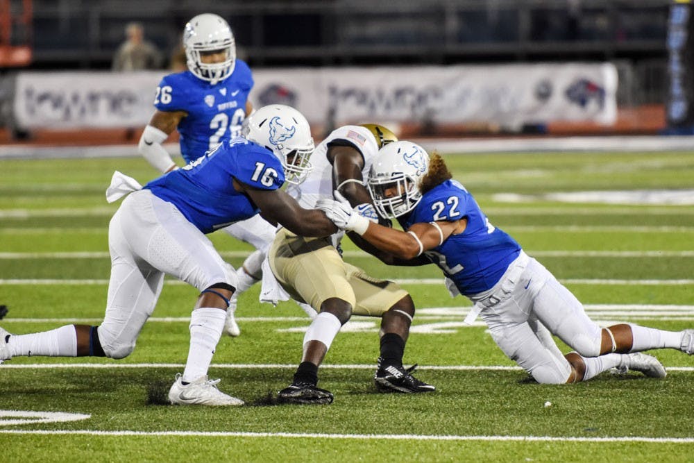 <p>Junior linebacker Ishmael Hargrove and junior safety Tim Roberts combine to make a tackle against Army last Saturday. Hargrove's strip sack on Saturday against Boston was&nbsp;UB's only score of the game.</p>