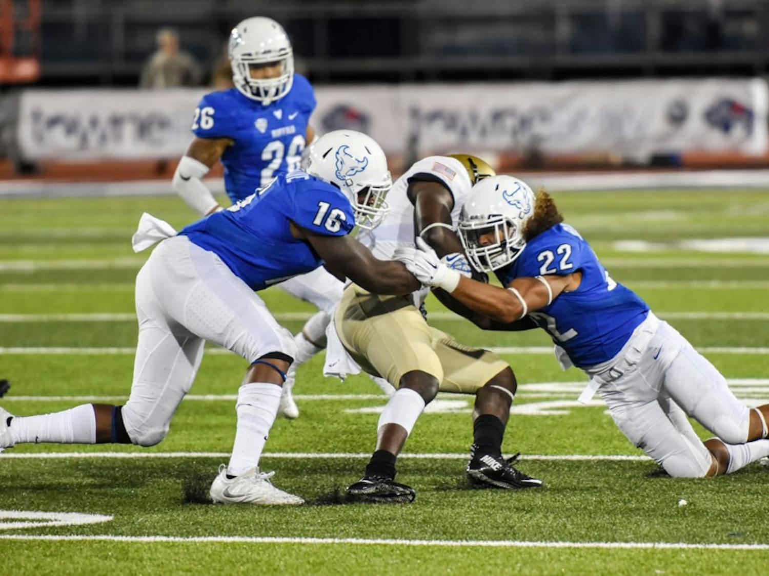 Junior linebacker Ishmael Hargrove and junior safety Tim Roberts combine to make a tackle against Army last Saturday. Hargrove's strip sack on Saturday against Boston was&nbsp;UB's only score of the game.