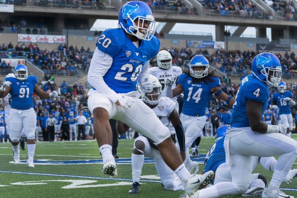 Freshman linebacker James Patterson is animated after the Bulls force a fumble against Akron. The Bulls became the number one defense in the Mid-American Conference after their win on Saturday.