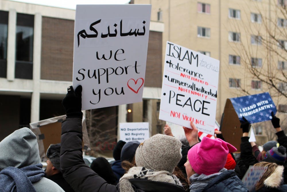 <p>Roughly 2,000 people participated in the “No Ba, No Wall” rally at Columbus Park on Sunday afternoon. Local refugees and immigrants, along with students and other members of the community, held signs and shared their personal stories.</p>