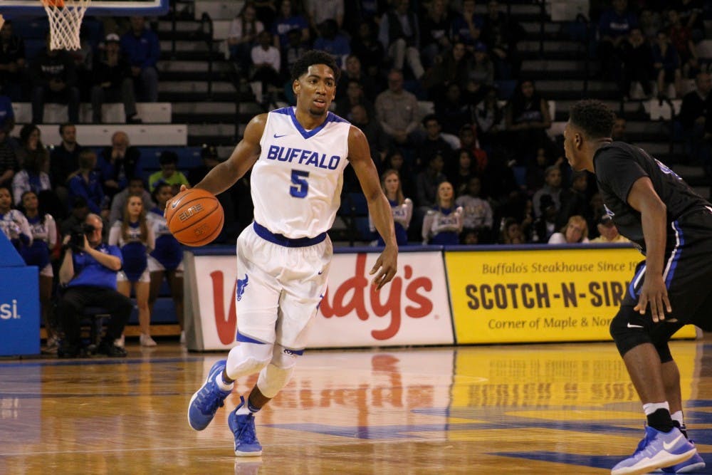 <p>Junior guard CJ Massinburg dribbles the ball up the court. Massinburg was selected to the preseason all-MAC team for the east division.</p>