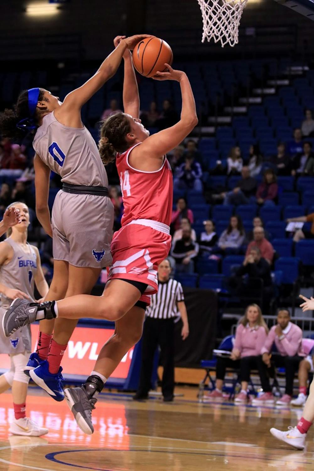 <p>Sophomore forward Summer Hemphill rejects the opposing player's shot. Hemphill had 18 points in the game against the Akron Zips on Saturday.</p>