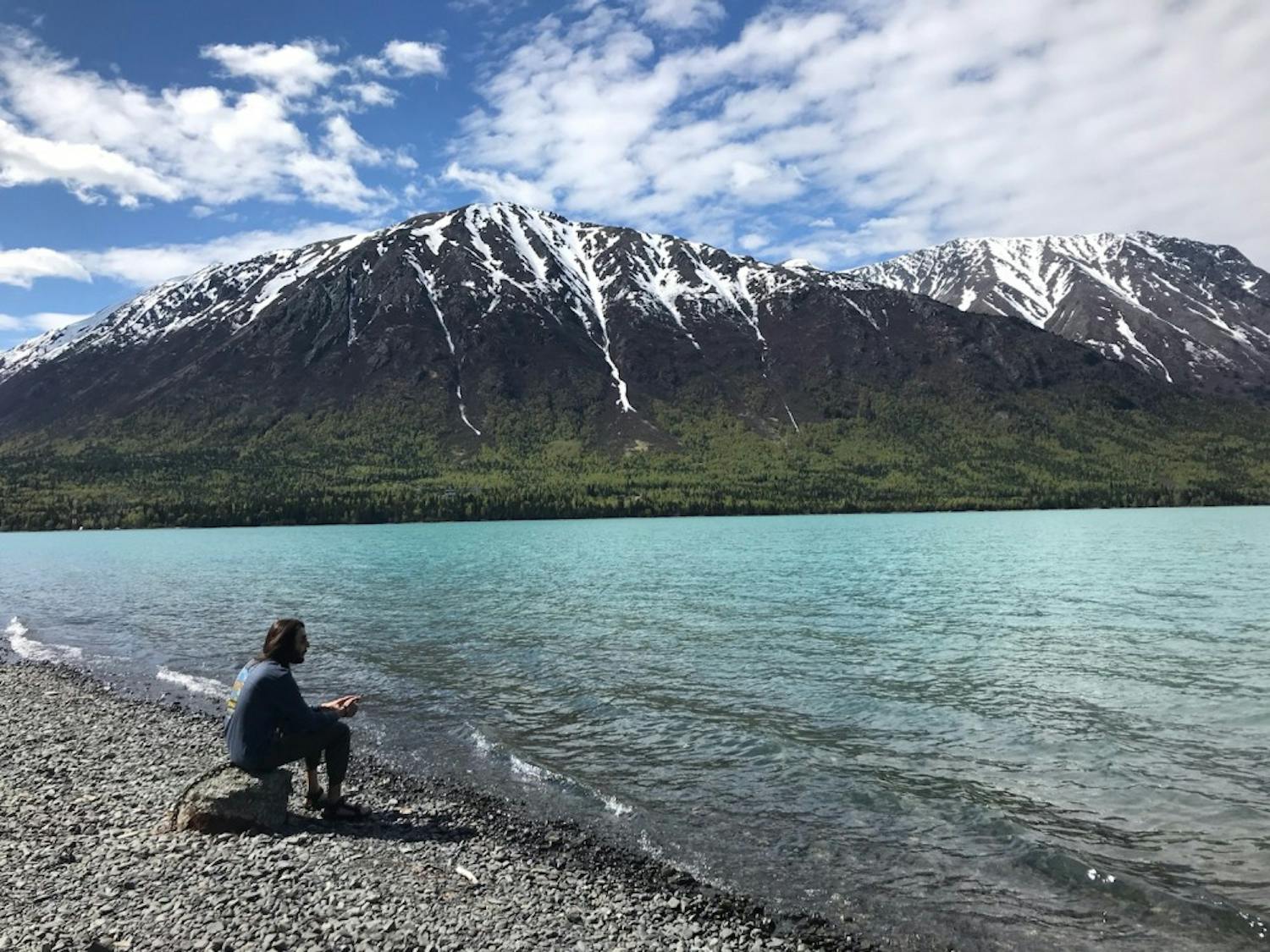 Senior news editor Max Kalnitz looks out on Kenai Lake, part of the Kenai Peninsula on Alaska's southern coast.