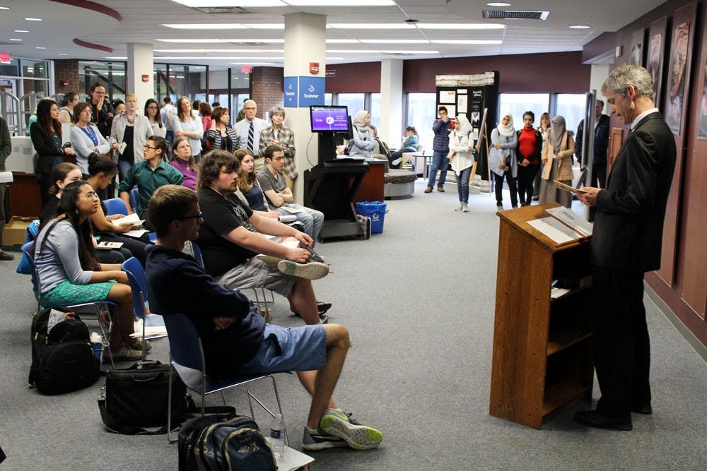 <p>John Wood, senior associate vice provost for International Education, speaks to students and faculty at the Shakespeare Read-A-Thon in Lockwood Memorial Library.</p>