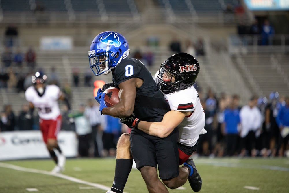 Freshman wide receiver Khamran Laborn gets tackled by a defender during UB's 33-27 overtime loss to NIU Wednesday.
