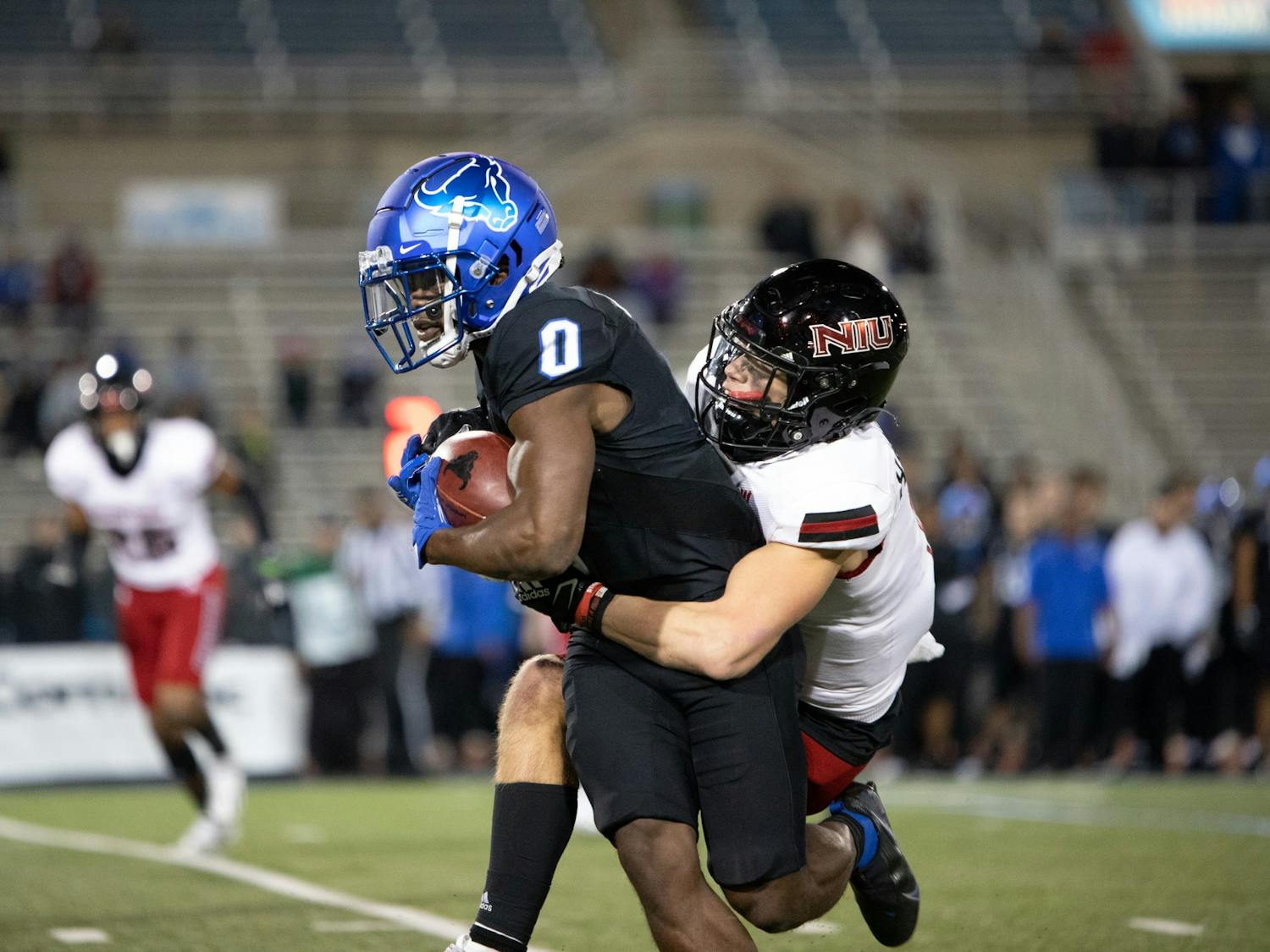 Freshman wide receiver Khamran Laborn gets tackled by a defender during UB's 33-27 overtime loss to NIU Wednesday.