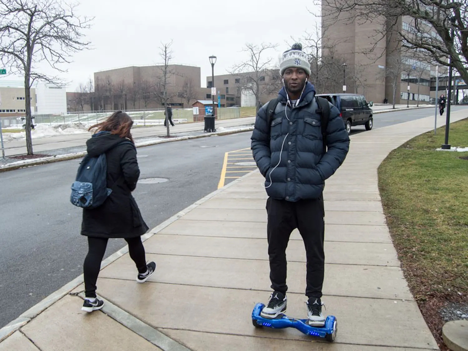 Antwann Kearse, a junior in business management, rides his hoverboard on campus. UB recently banned hoverboards in the dorms and apartments, citing fire hazards. 