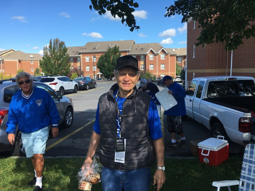 <p>Jim McNally hangs out at his tailgate. McNally played and coached at UB for over a decade and was inducted into the UB Athletics Hall of Fame in 1982.</p>