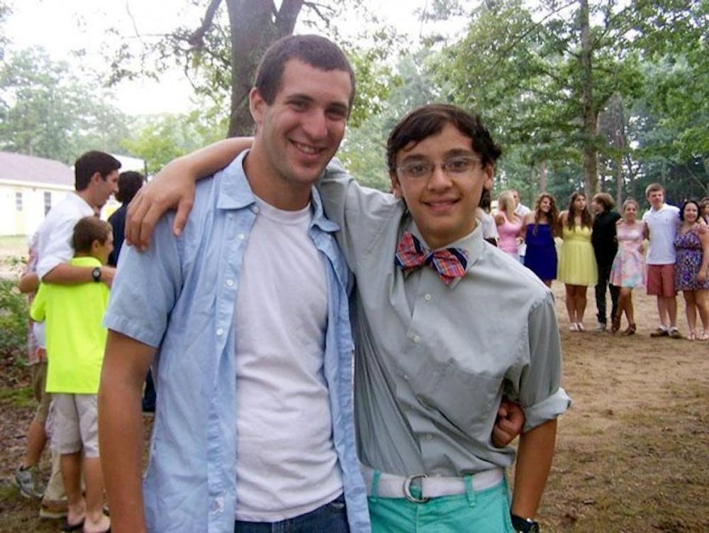 <p>Steven Kahn, a sophomore chemistry major, with one of his campers at the summer camp where he works in Rhode Island. Though Kahn feels fortunate to have a summer job, he wishes he was able to secure an internship in his desired professional field.</p>