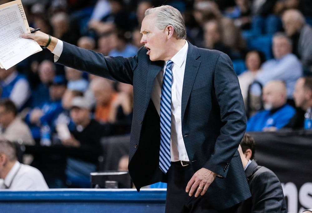 <p>Head coach Jim Whitesell shouts directions at the Bulls. Whitesell is the 14th head coach in UB men’s basketball program history after a national search determined him as the best candidate.</p>