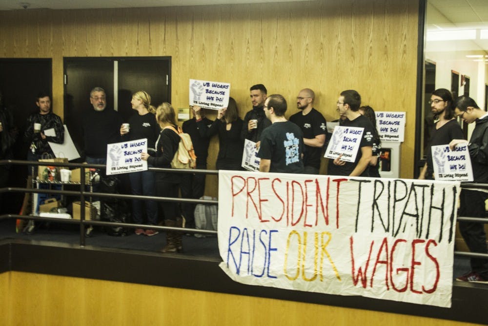 <p>Graduate students and faculty members protesting on the fifth floor of Capen Hall during Monday’s UB Council meeting. By not moving to a larger room to accommodate members of the public who wanted to attend the meeting, the council violated New York State Open Meetings Law, according to New York State’s top open-government official.</p>