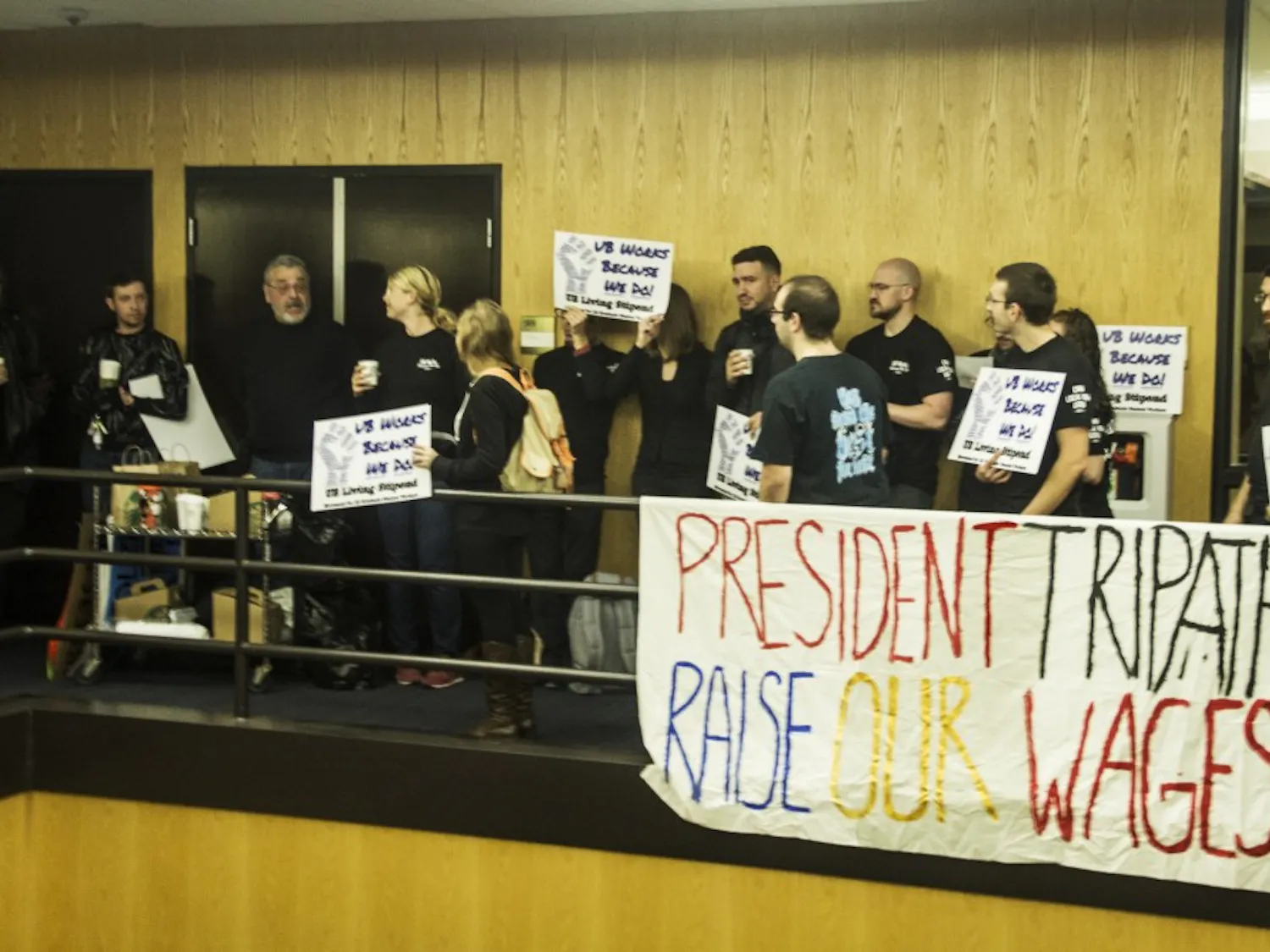 Graduate students and faculty members protesting on the fifth floor of Capen Hall during Monday’s UB Council meeting. By not moving to a larger room to accommodate members of the public who wanted to attend the meeting, the council violated New York State Open Meetings Law, according to New York State’s top open-government official.