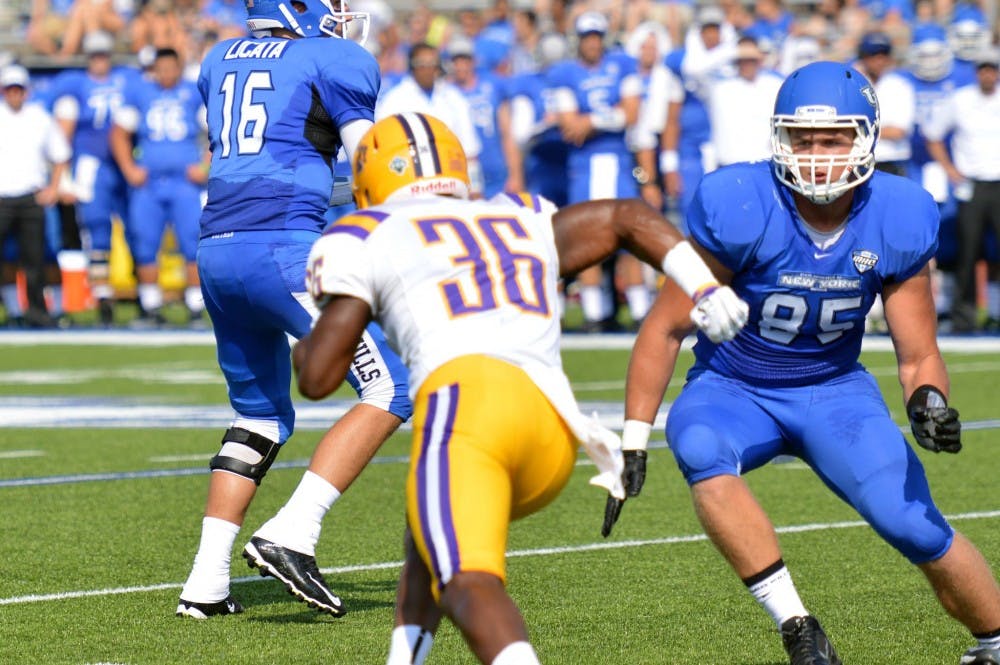 <p>Senior tight end Mason Schreck (85) gets ready to block an Albany pass rusher (36) in Buffalo's 51-14 win at UB Stadium Saturday. Schreck and fellow tight end Matt Weiser may be integral parts of the Bulls' offense this year. </p>