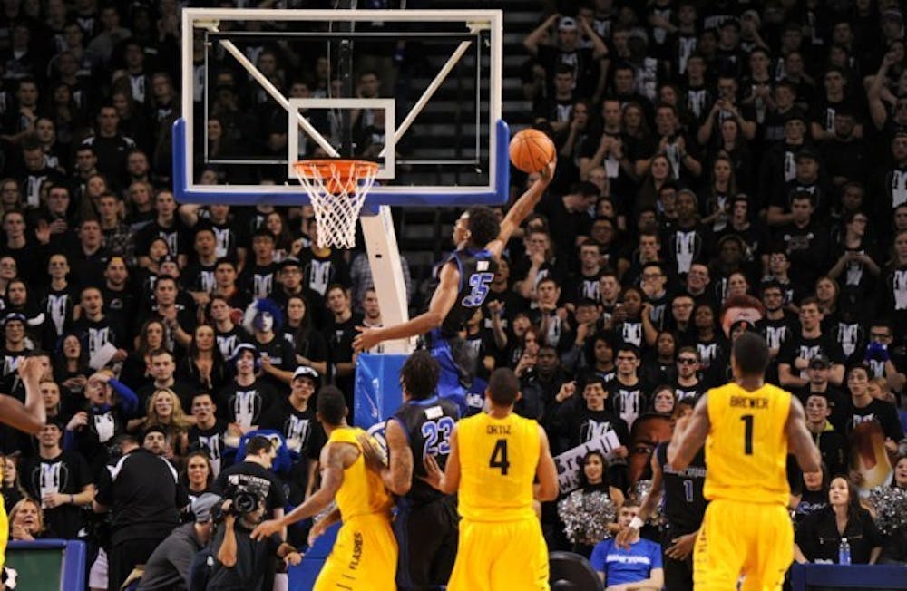 Senior forward Xavier Ford slams down the ball in Buffalo&#39;s 80-55 win Friday night.&nbsp;Yusong Shi, The Spectrum.