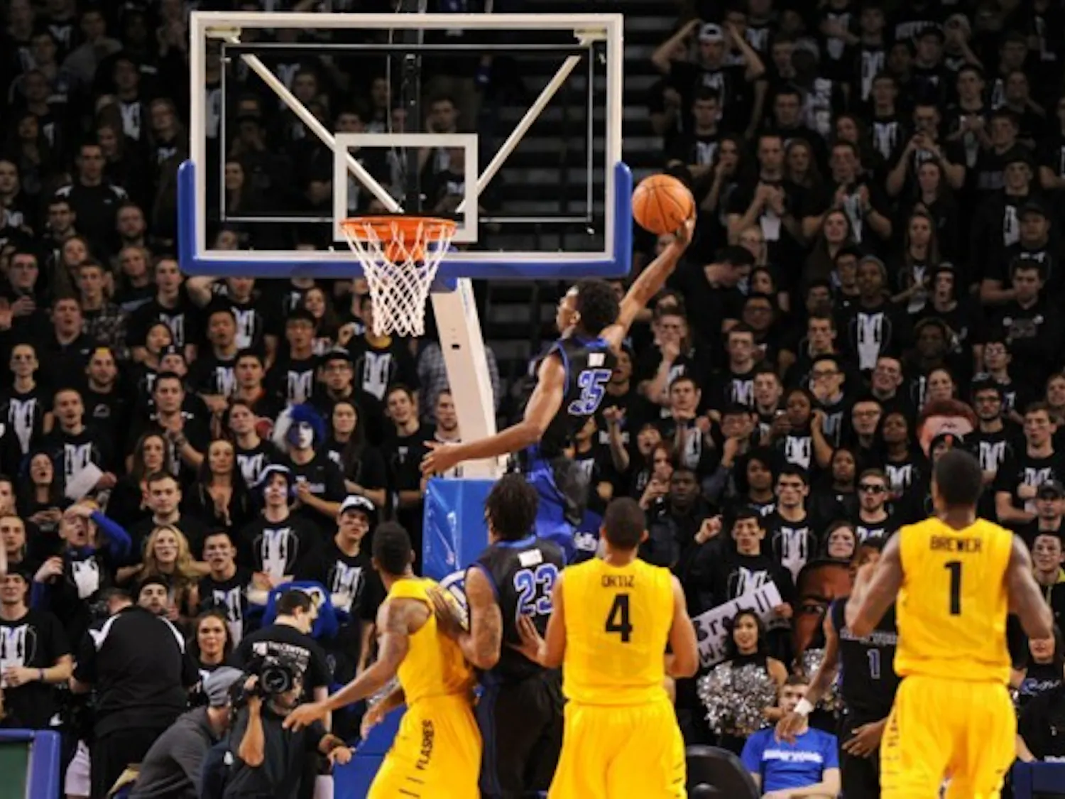 Senior forward Xavier Ford slams down the ball in Buffalo's 80-55 win Friday night. Yusong Shi, The Spectrum.