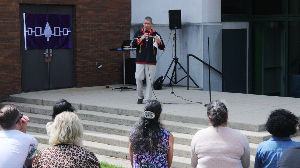 <p>Pete Hill, ‘91 alum and “All Our Relations” director of the Native American Communities Services of Erie & Niagara Counties, speaks at the Native American welcome event outside the Student Union. NACS will work with the Office of Inclusive Excellence and faculty members this year to bring more inclusive events to UB.</p>