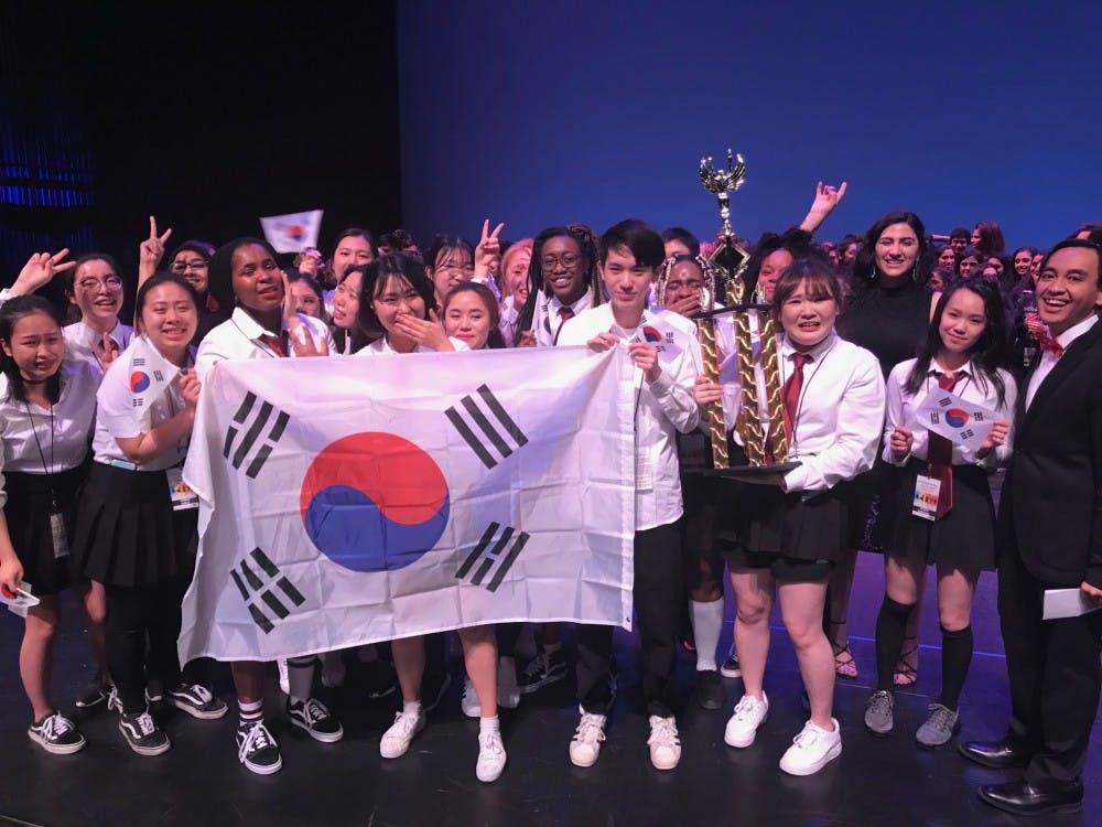 <p>The Korean Student Association accepts the first place trophy at the 2019 International Fiesta.</p>