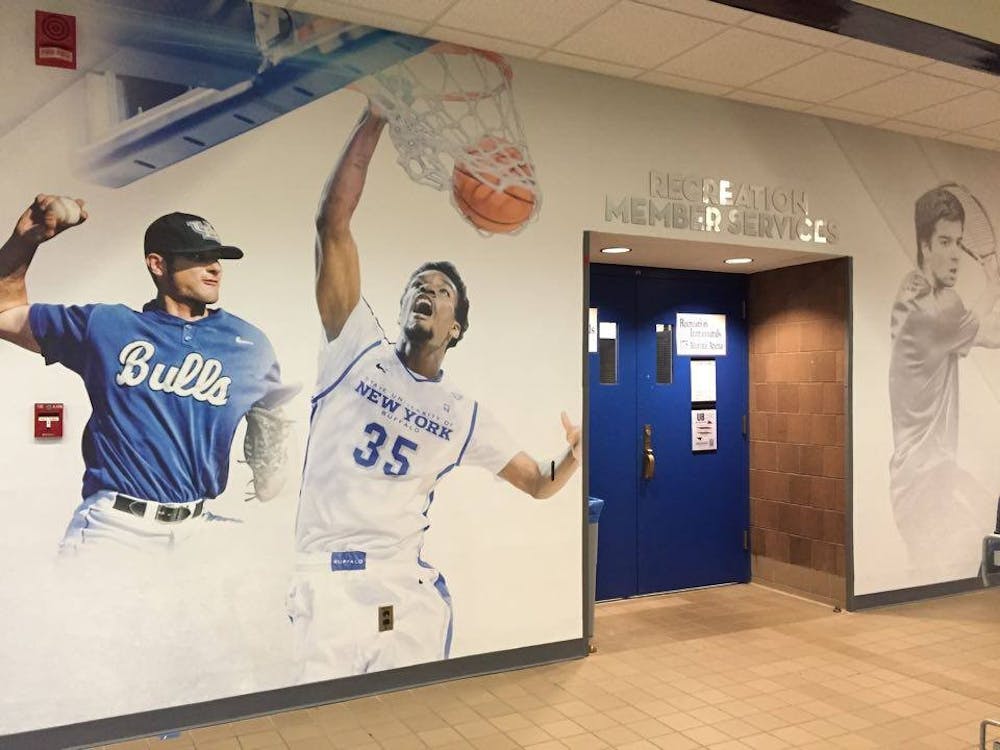 <p>An image of former Bull Xavier Ford (No. 35) dunking&nbsp;replaced an&nbsp;image of Evans on the Alumni Arena lobby wall. The wall features other players who are also no longer at UB.&nbsp;</p>