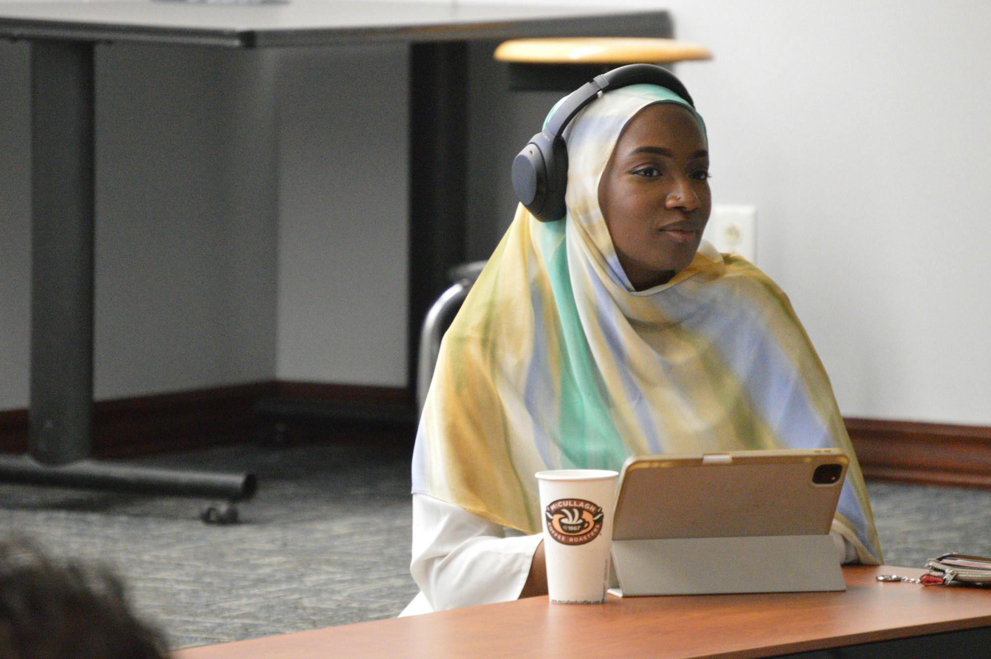 SA President Aisha Adam introduces the resolution to raise e-board stipends to $24,180 for third and final time this semester during Wednesday's last Senate meeting.