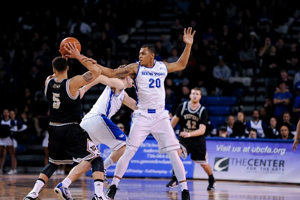 <p>Senior forward/guard Rodell Wigginton defends during a win over Western Michigan in Alumni Arena last season. Eastern Michigan defeated the Bulls 81-69 on the road Tuesday night.&nbsp;</p>