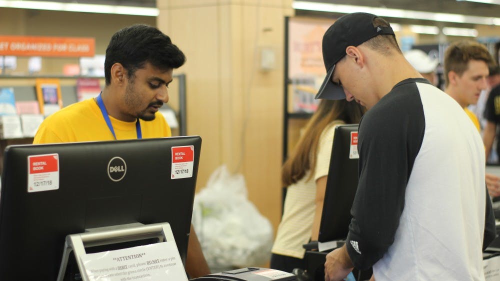 <p>Students break out their wallets every semester to pay for textbooks at the UB Bookstore. As lines remain long in the first two weeks, the bookstore can match prices with a number of eligible textbooks at vendors like Amazon and Barnes & Noble.</p>