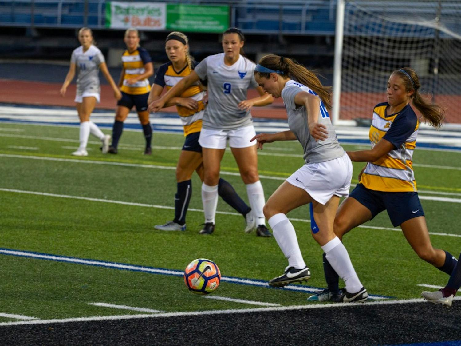 Freshman midfielder Katherine Camper dribbles the ball past a defender. The Bulls lost 4-2 to Western Michigan this past Sunday in what was a season high in goals allowed.
