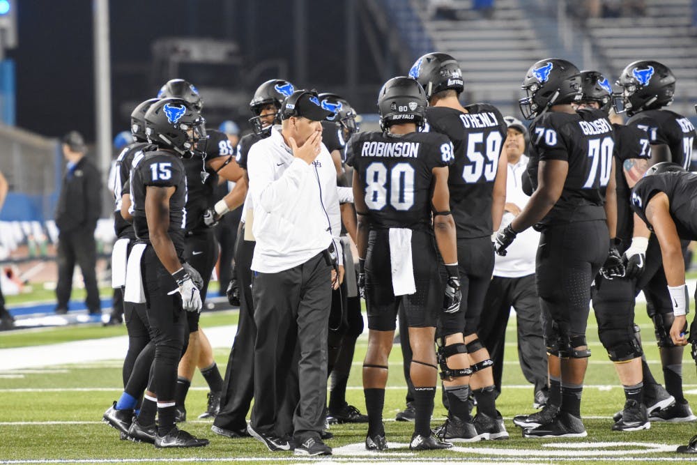<p>UB's offense huddles before a play. The offense will need to step up if UB wants to be a contender in the MAC.</p>