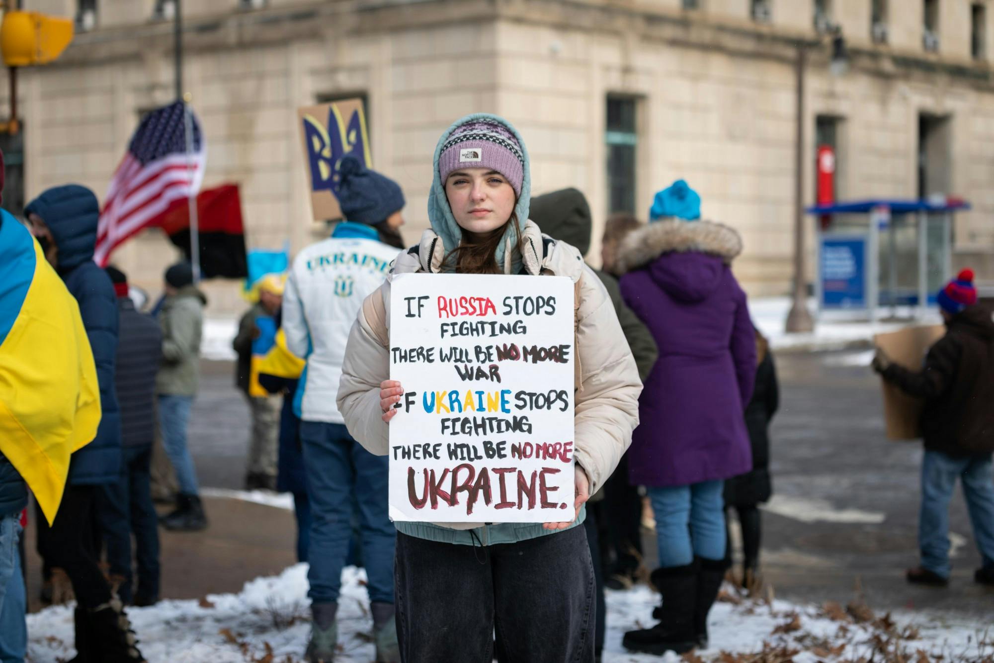 A protester holds up a sign during a pro-Ukraine rally outside of City Hall last week.
