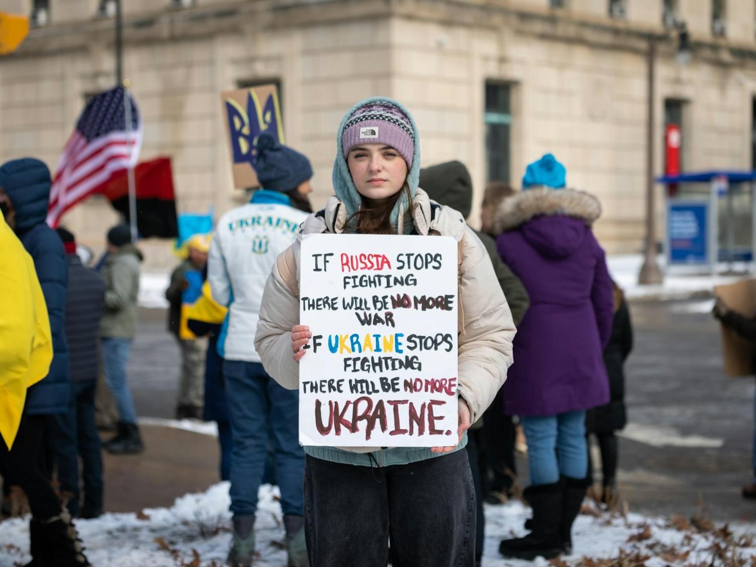 A protester holds up a sign during a pro-Ukraine rally outside of City Hall last week.

