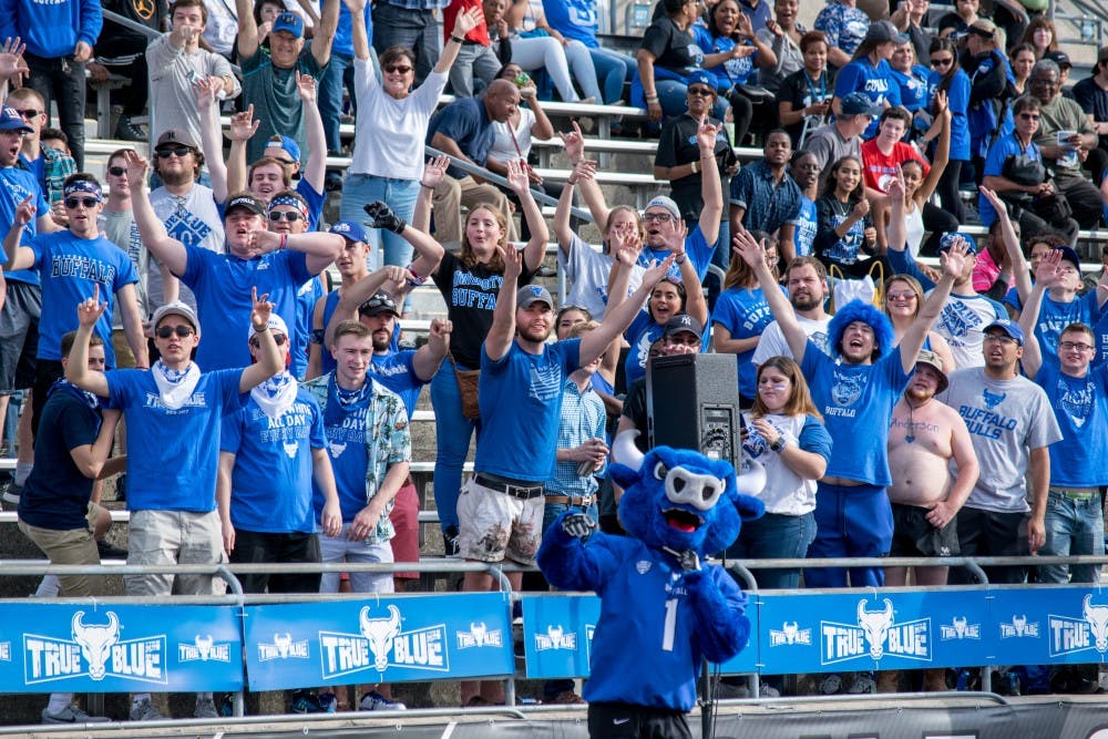 Victor E. Bull and True Blue cheer in the student section at UB Stadium.