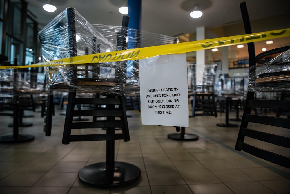 <p>Chairs rest on top of tables in the Student Union.</p>