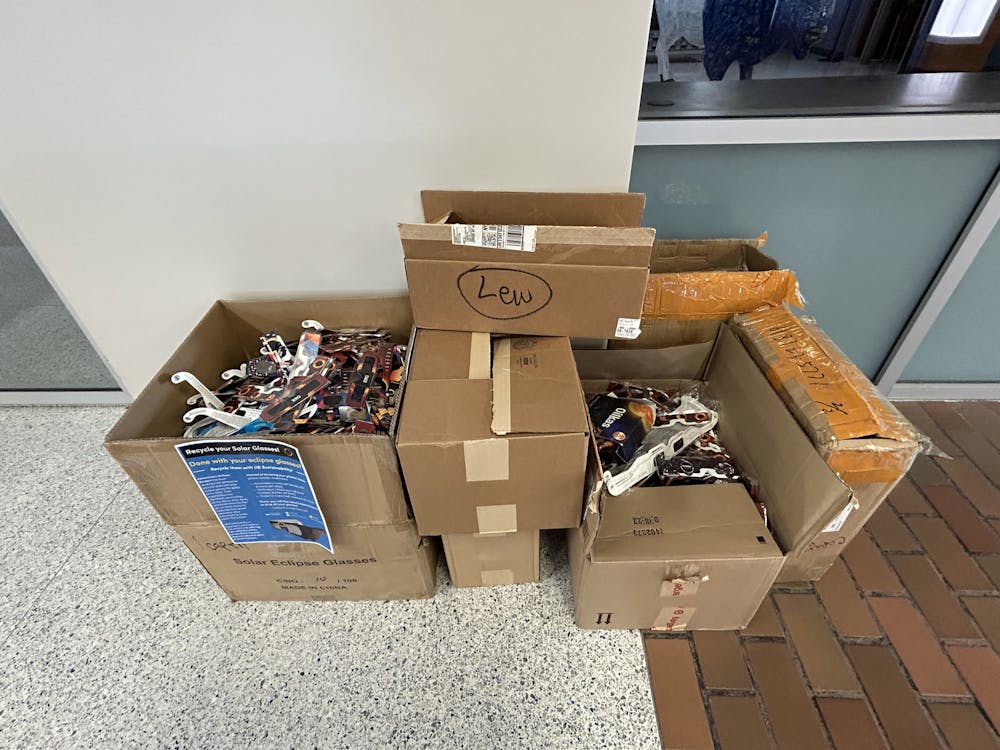 <p>Dozens of eclipse glasses have already been collected outside 1Capen.&nbsp;</p>