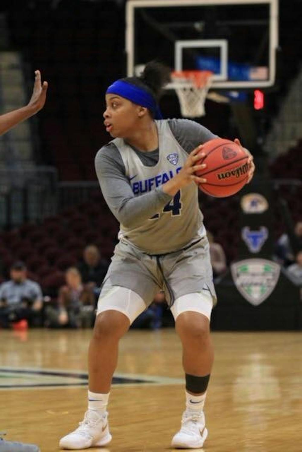 <p>Junior guard Cierra Dillard looks for an option as defender post-up to her. Dillard was the lead scorer in the Bull's first NCAA Tournament win on March 17 against the South Florida Bulls.</p>