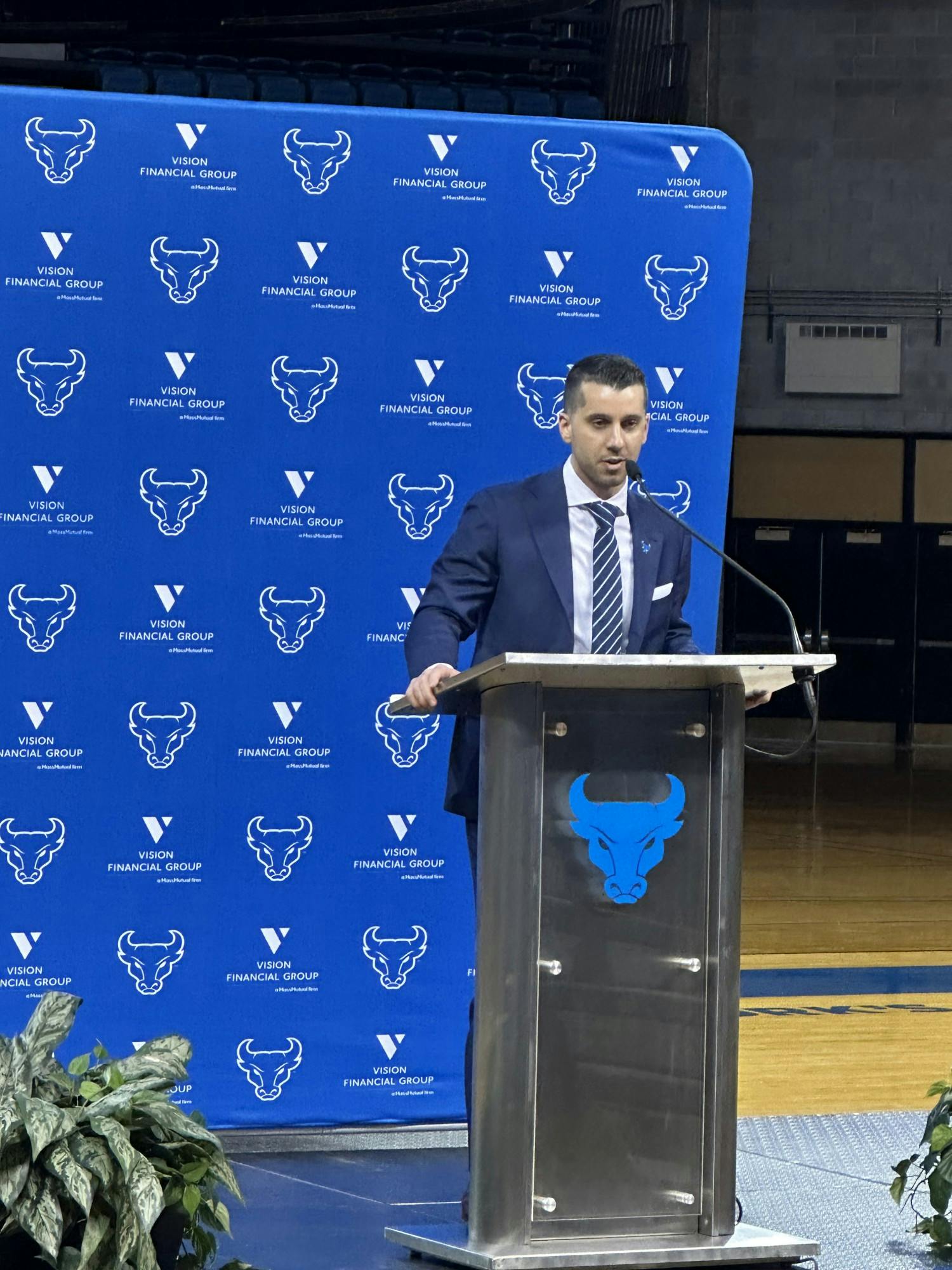 Halcovage arriving to an introductory press conference with the UB marching band and fans in 2023.