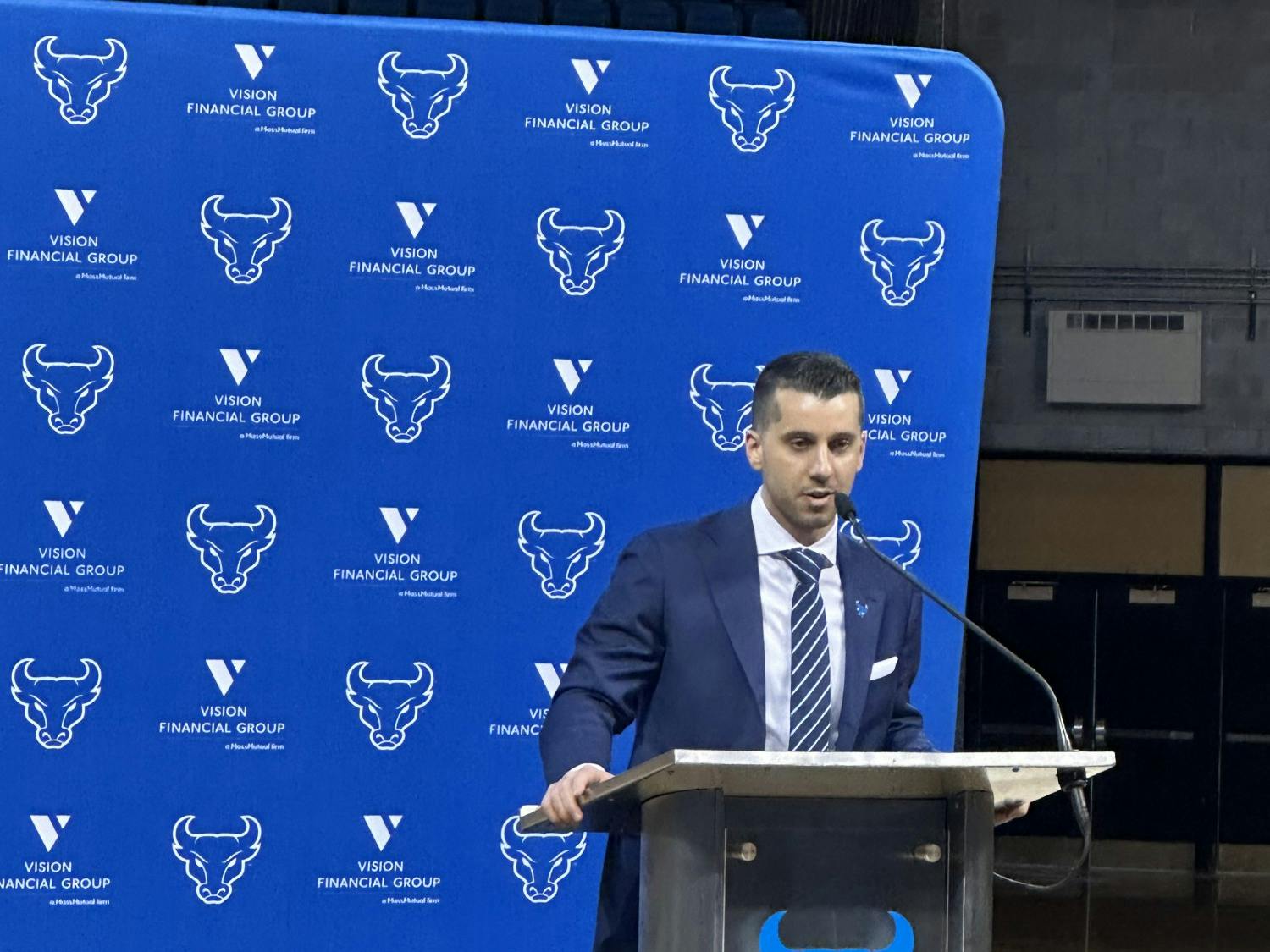 Halcovage arriving to an introductory press conference with the UB marching band and fans in 2023.