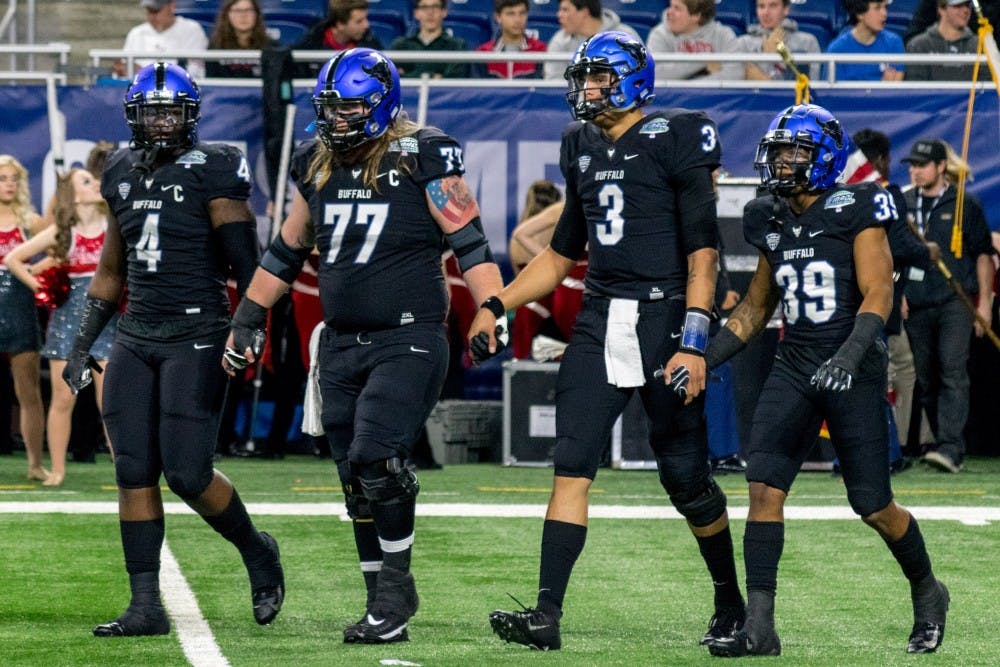 <p>Captains of the UB football team including Tyree Jackson (3) and Cameron Lewis (39) walk onto the field at the MAC Championship game. Jackson and Lewis both became members of the Bills this weekend.</p>