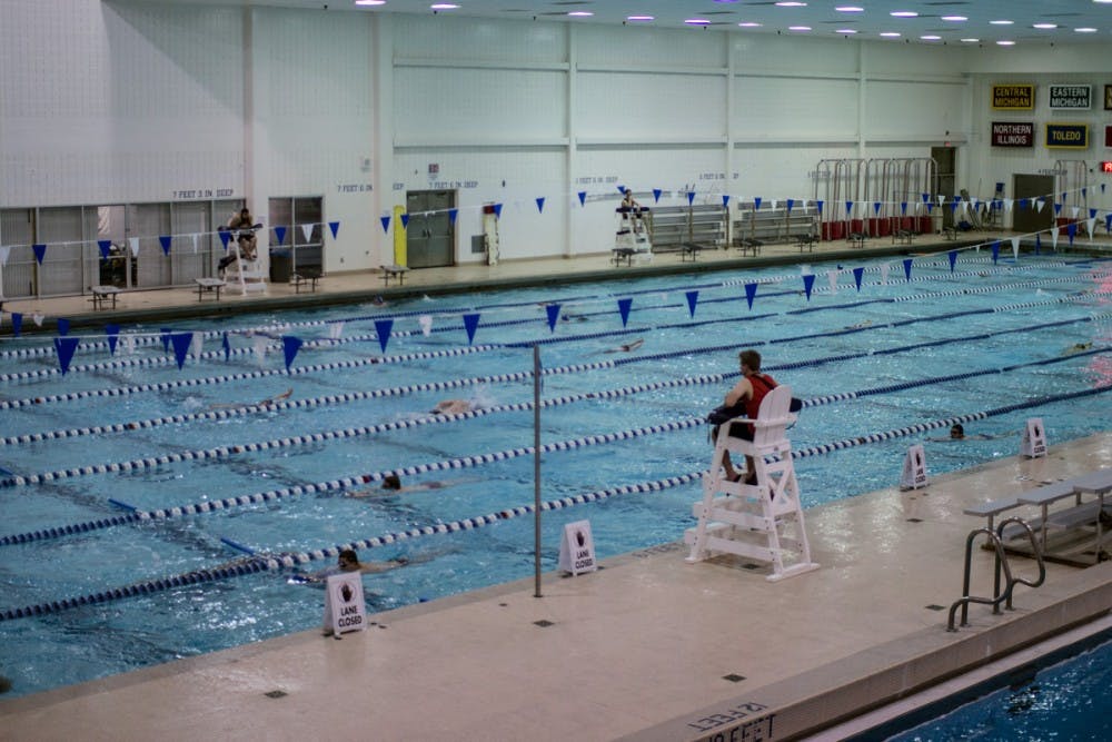 <p>A UB lifeguard watches the Alumni Arena pool for both recreational and team swimmers Thursday. </p>