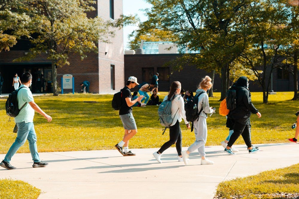 Students walk around campus on a recent weekday. There are more than 4,400 international students at UB.
