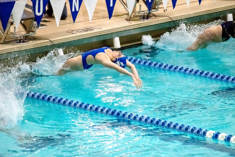 <p>Sophomore swimmer Grace Baumer performs the breaststroke at Saturday’s meet. She had three first-place finishes in the meet including the breaststroke 100m and 200m.</p>