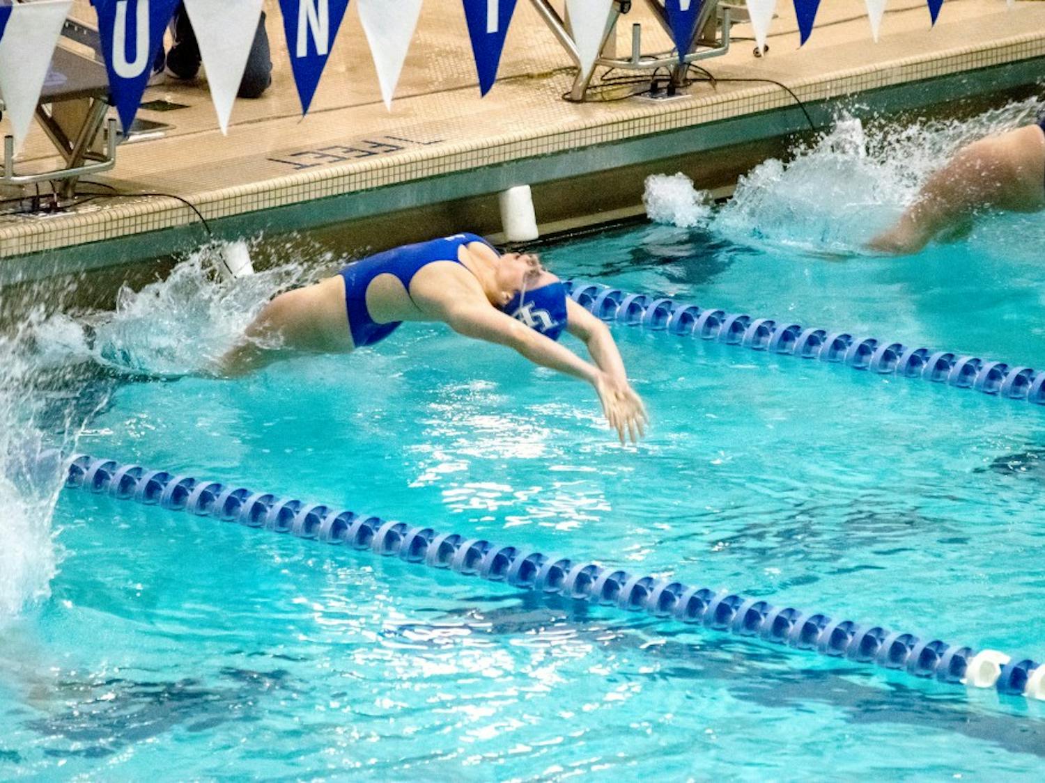 Sophomore swimmer Grace Baumer performs the breaststroke at Saturday’s meet. She had three first-place finishes in the meet including the breaststroke 100m and 200m.
